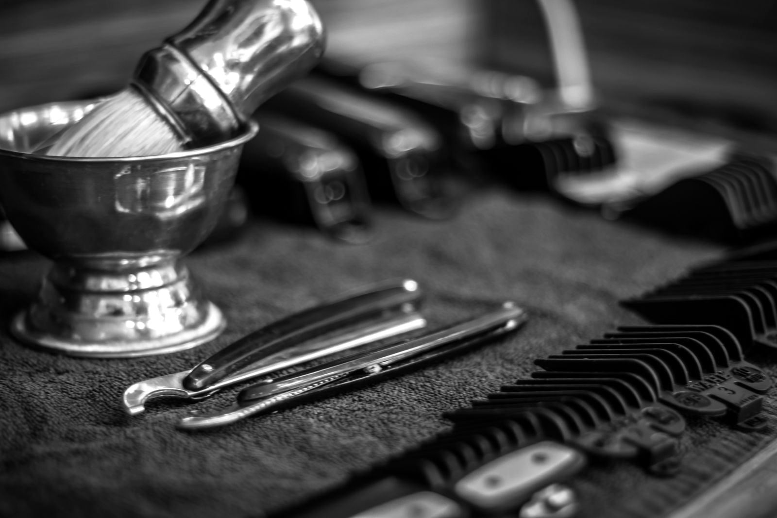 Shave brush, razors and combs laid out