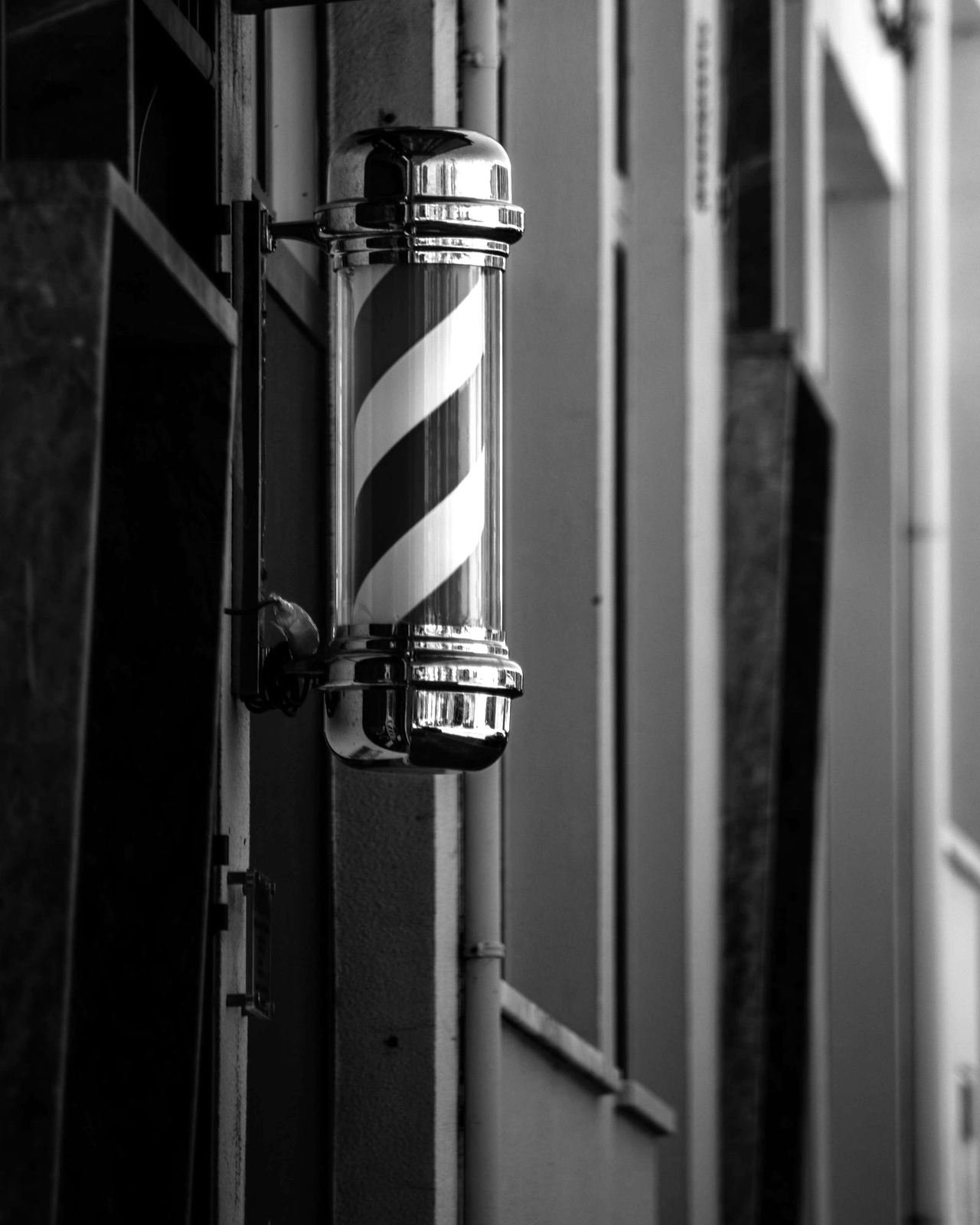 Barber pole outside the shop