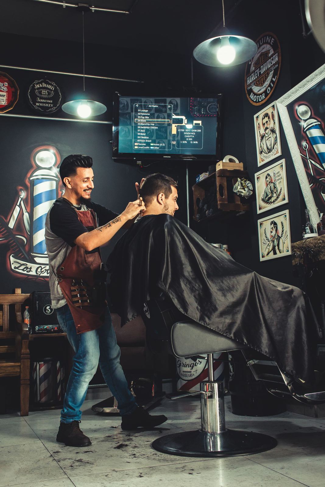 Barber at the corner chair with the pole behind