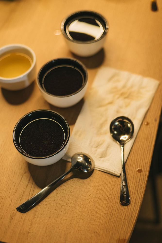 Cupping bowls and spoons on a wooden table