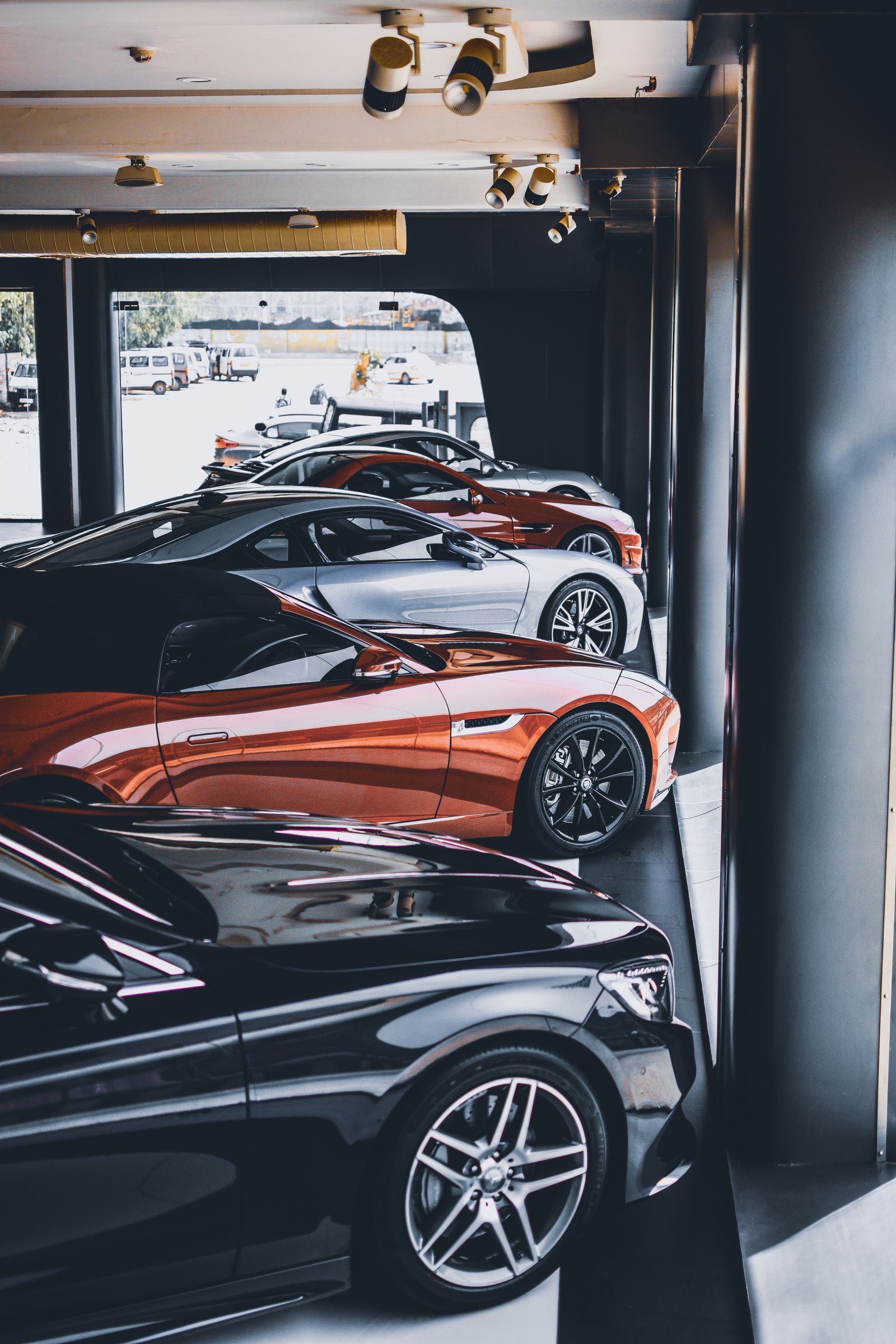 Private garage with a BMW i8 and other sports cars