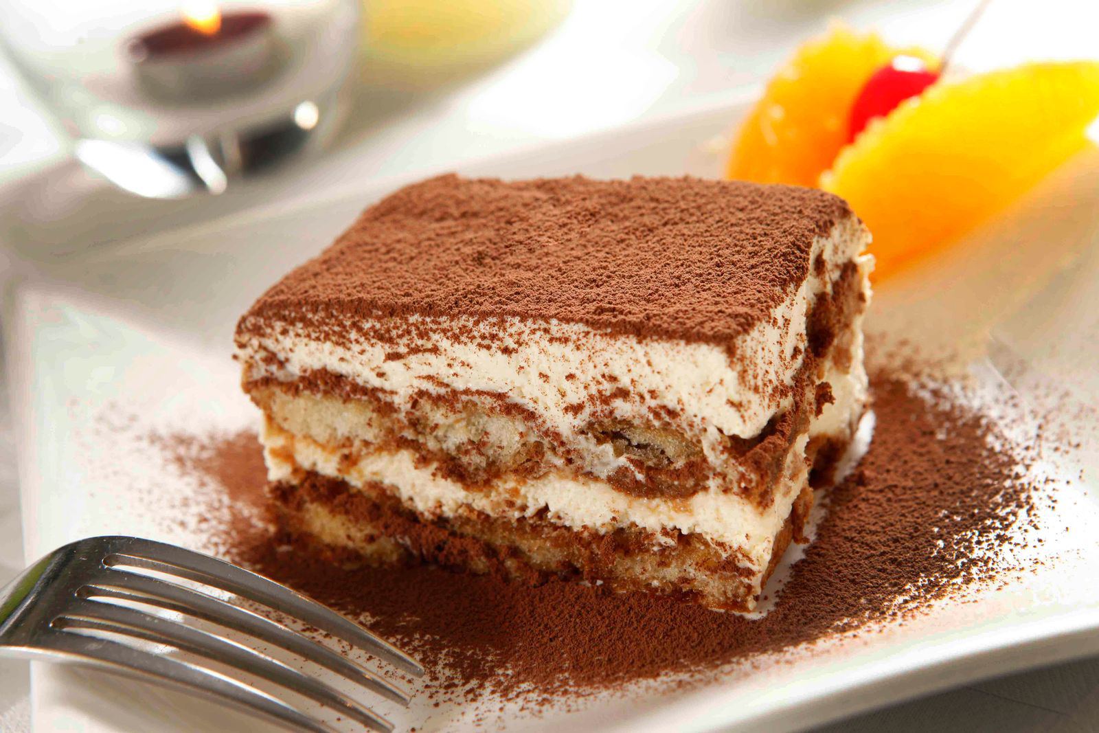 A square of tiramisu dusted with cocoa